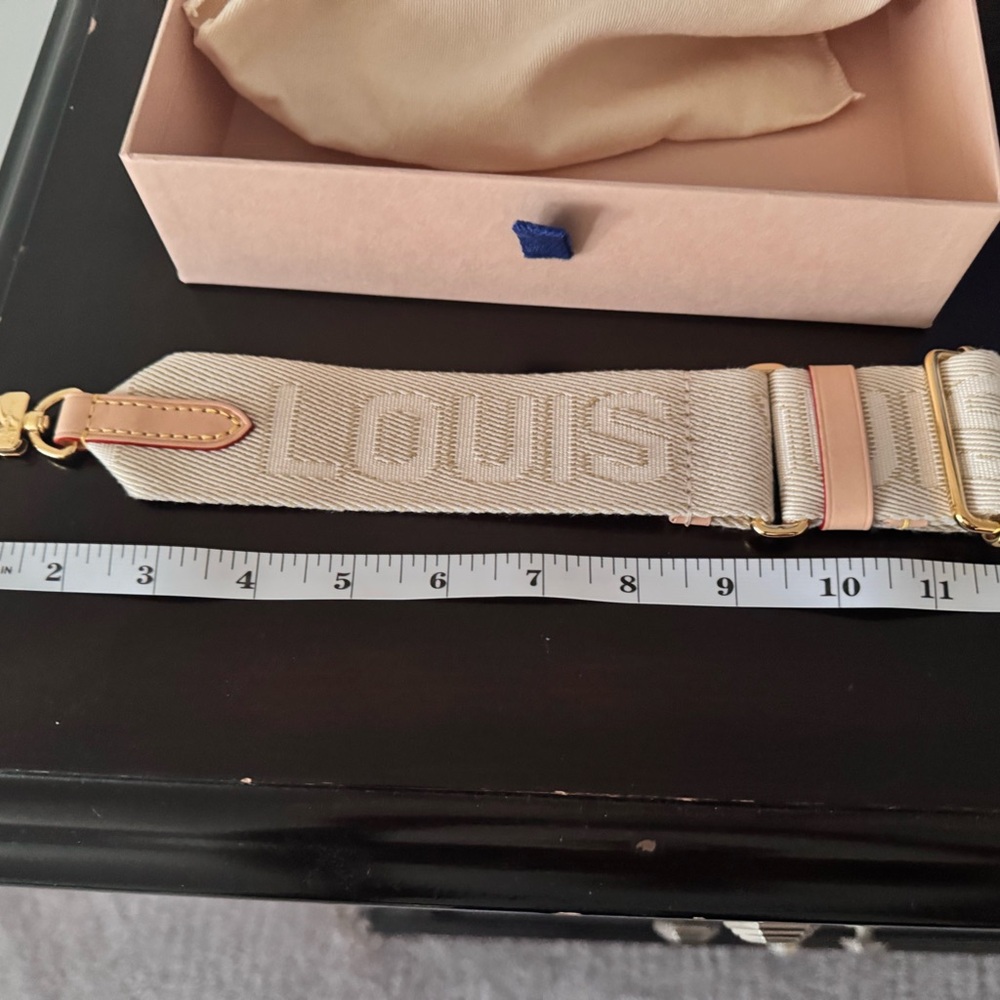 Louis Vuitton Cream Strap with Gold Accents